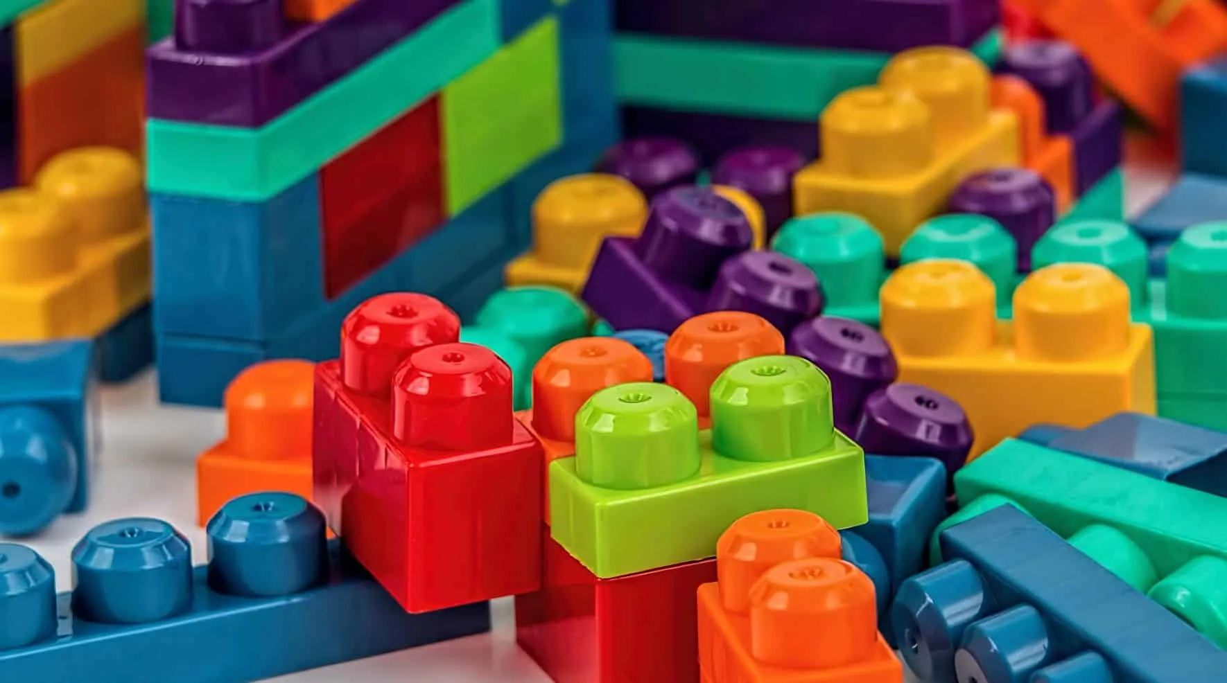 Pile of colorful building bricks wedged into each other